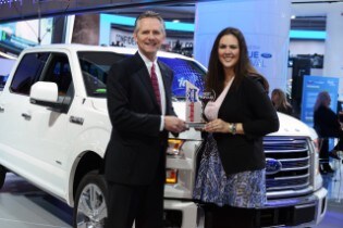 Doug Scott, Ford Truck Group Marketing Manager, receives ...